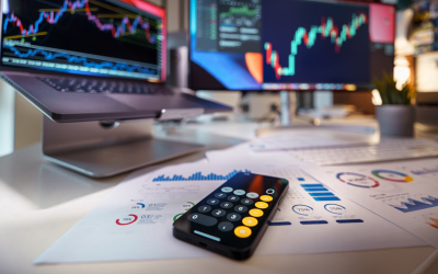 Trading trends and data analysis on two computer screens