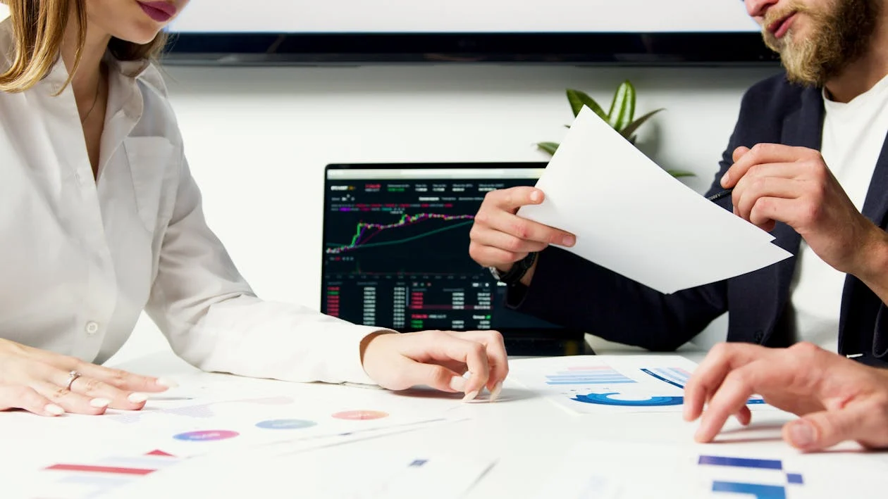 people analyzing trends and data in trading