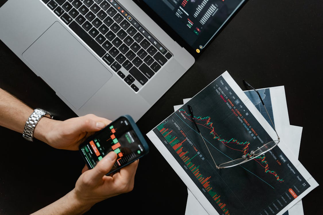 trader checking his/her phone